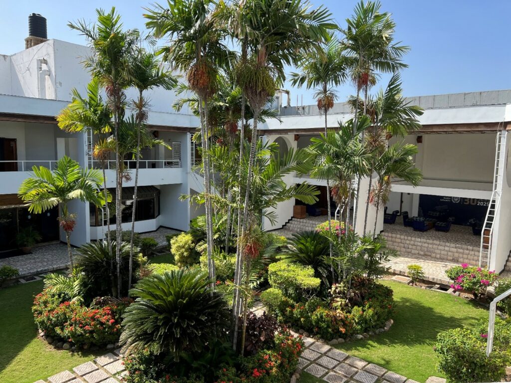 After long and conflictual hours in the negotiation room, the courtyard is a welcome reminder that we are in the Caribbean after all (Source: Emil W. Hildebrand)